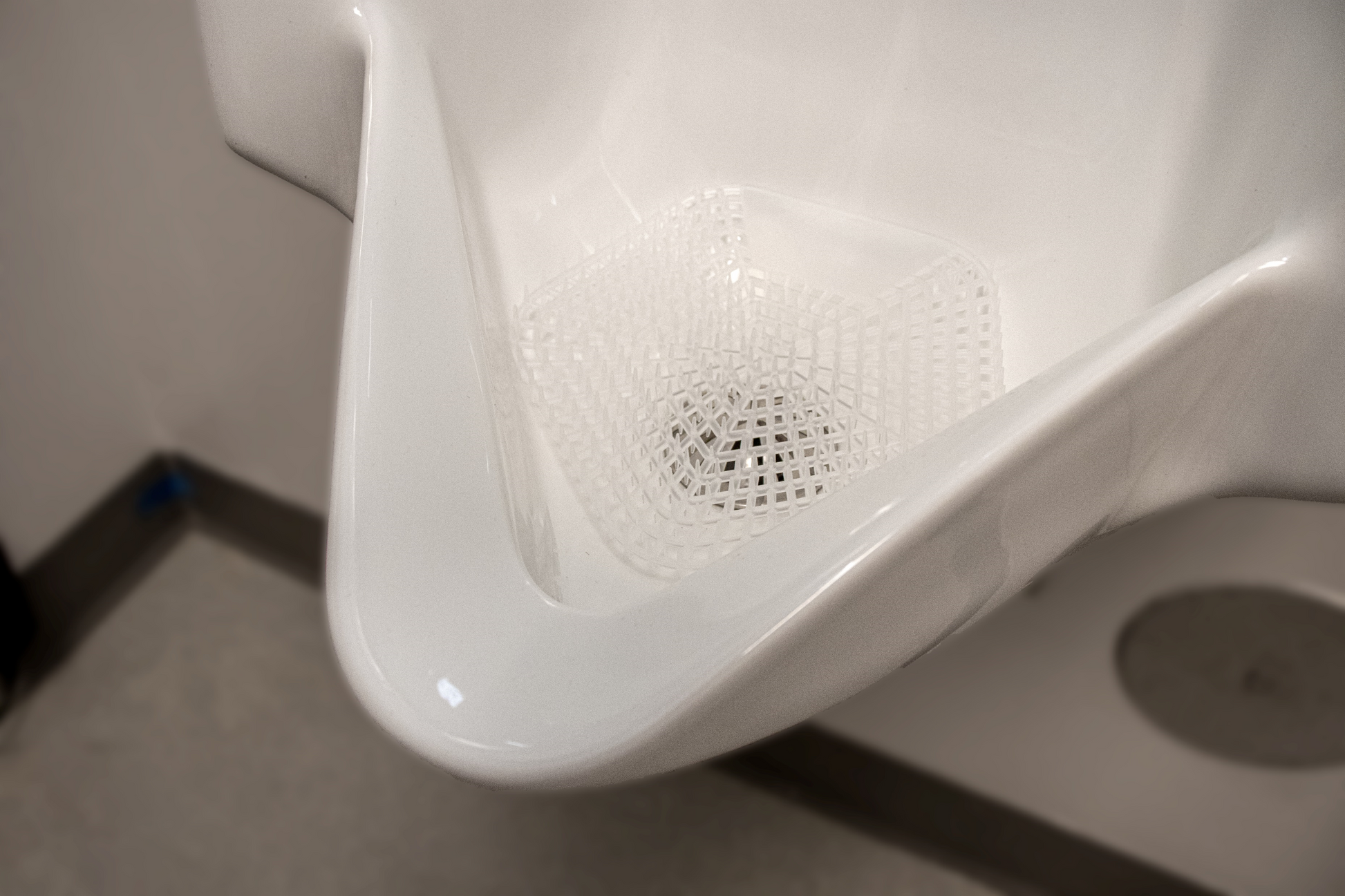 An image of the WCBasix Fresh Linen (Clear colour) in a white urinal