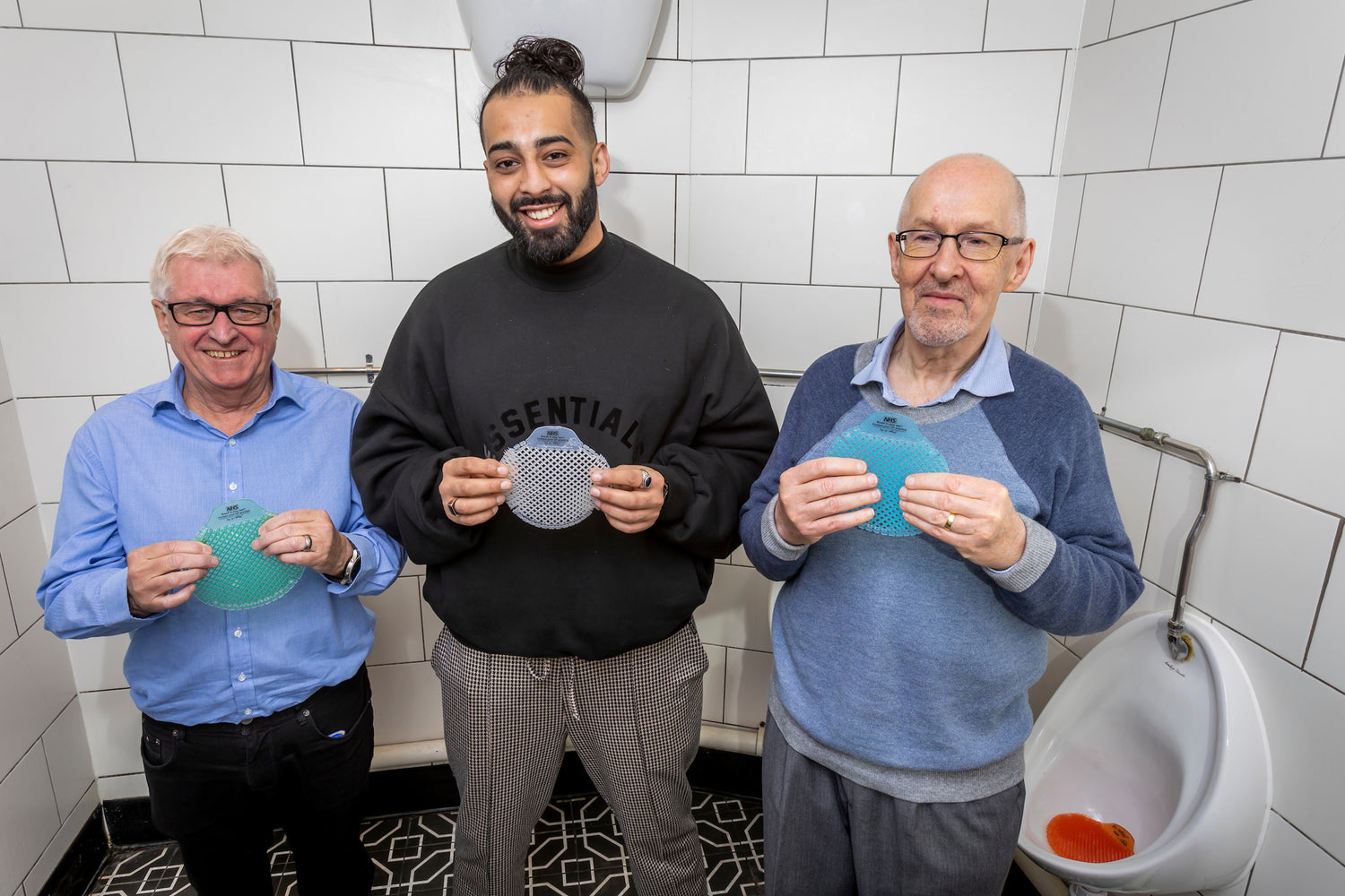 NHS x P-Wave cancer survivors holding P-Wave mats