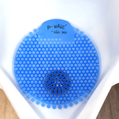 A bird's eye view image of a blue Cotton Blossom P-Wave 360 urinal screen in a white urinal
